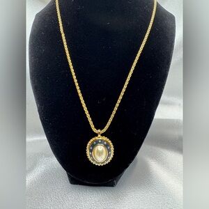 Burberry’s Flax Pearl Dark Blue Pendant with Burberry Gold Tone Necklace